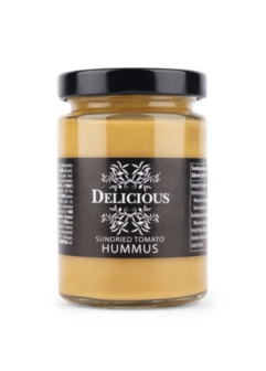 Delicious hummus zongedroogde tomaat